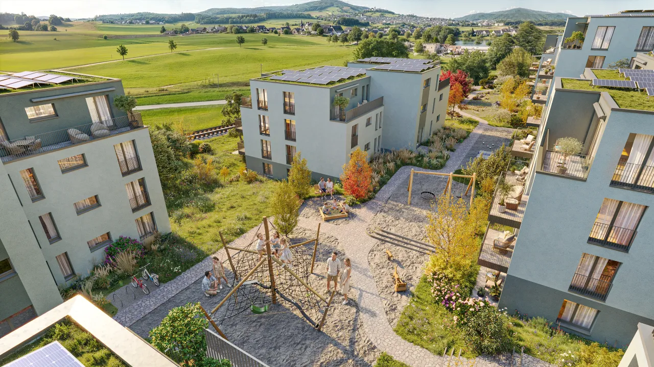 Aerial rendering of a residential courtyard with a playground between new apartment blocks
