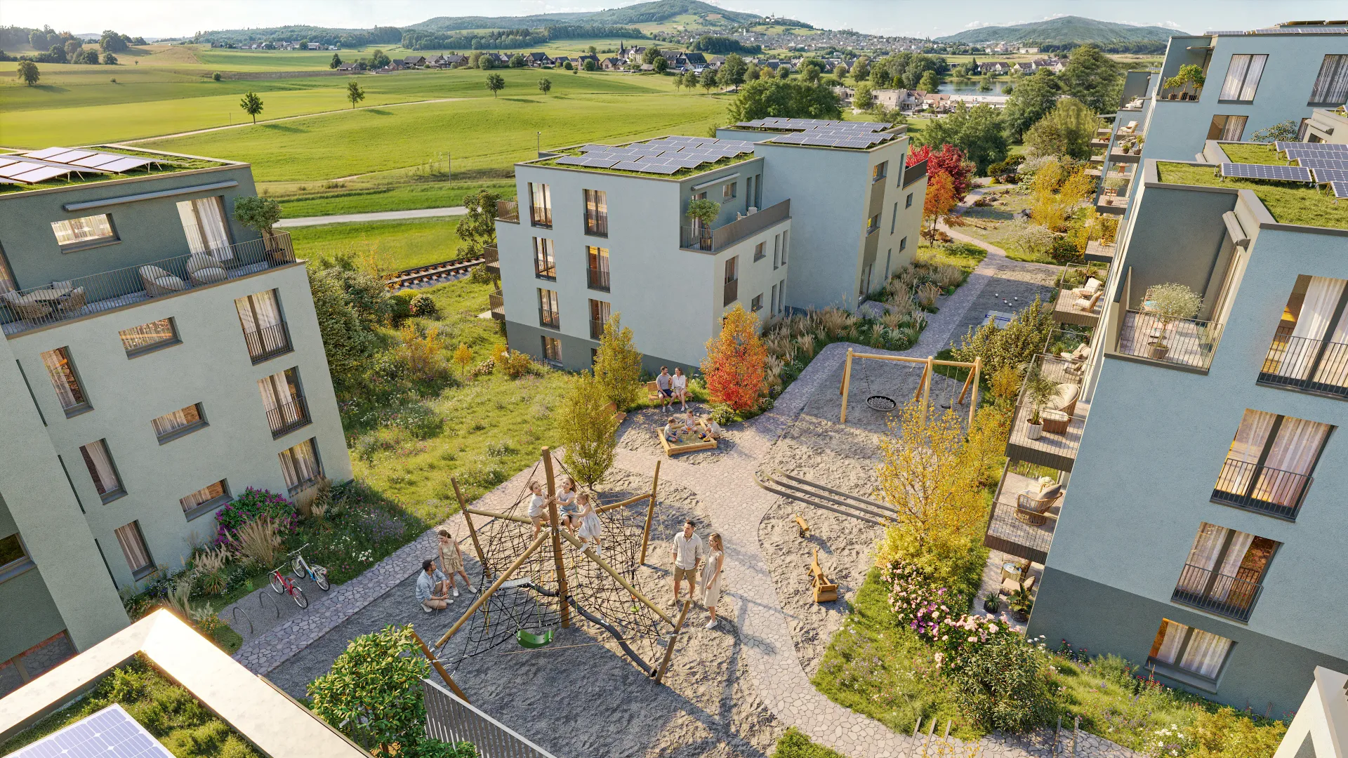 Aerial rendering of a residential courtyard with a playground between new apartment blocks