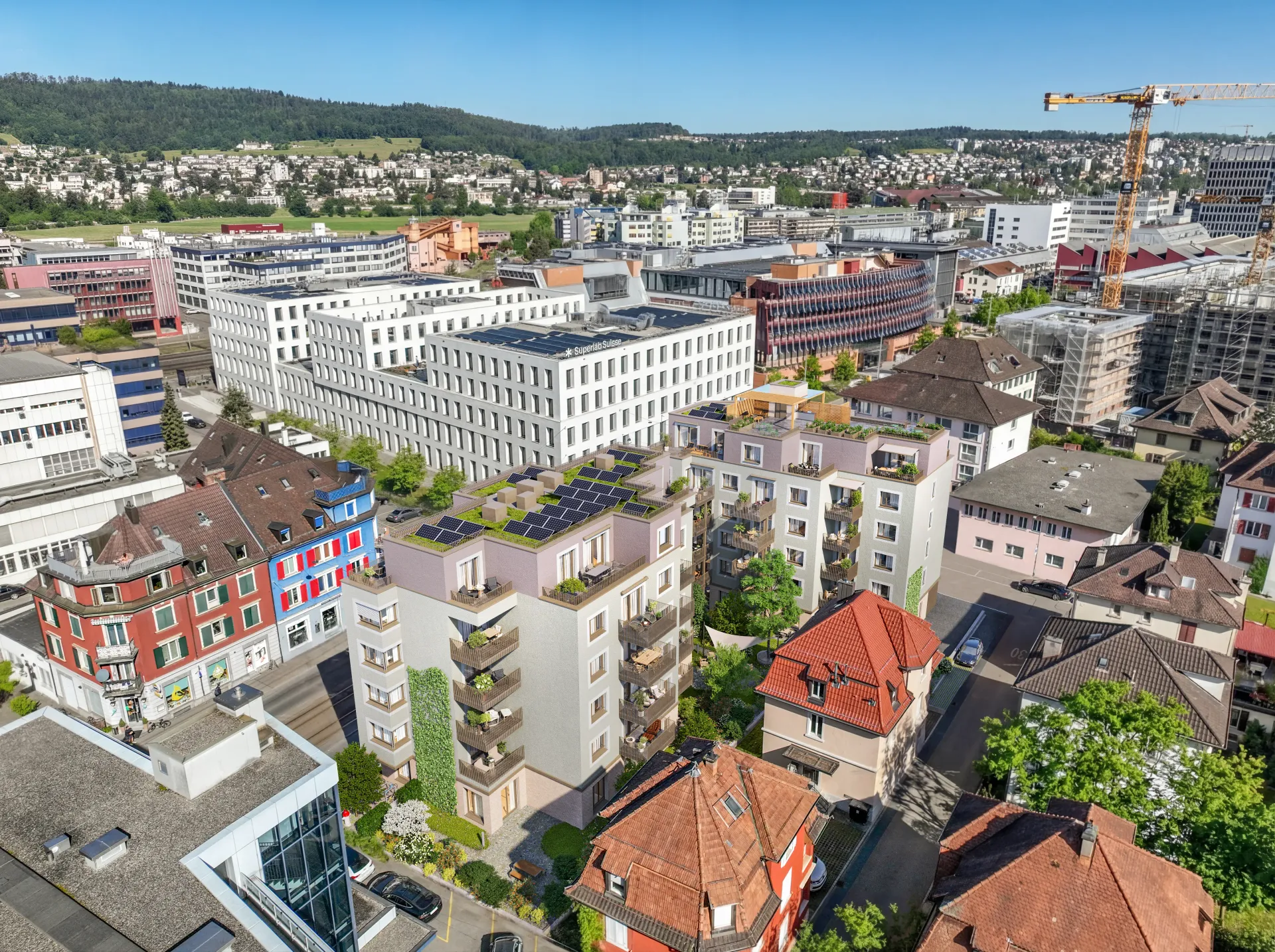 Aerial rendering of a city quarter with new white apartment buildings, red roofs, a tower crane and hills