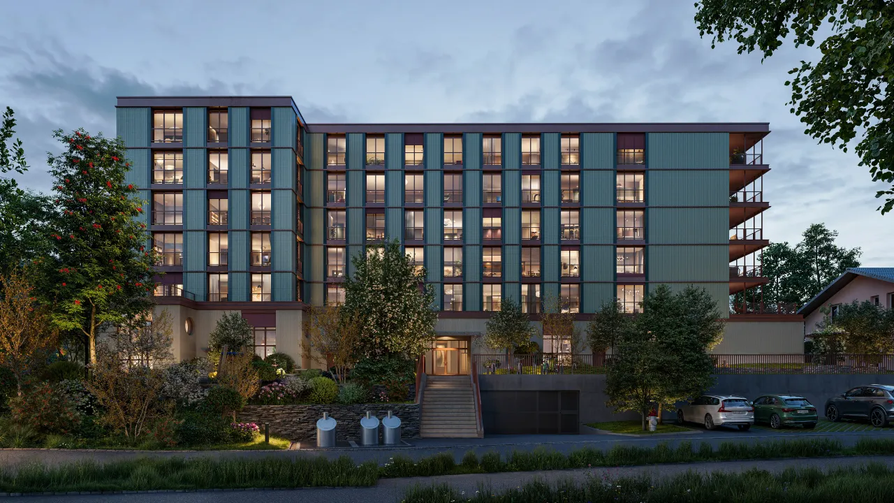 Exterior rendering of a seven-storey apartment building with green-blue facade and lit windows at dusk, framed by trees and a driveway