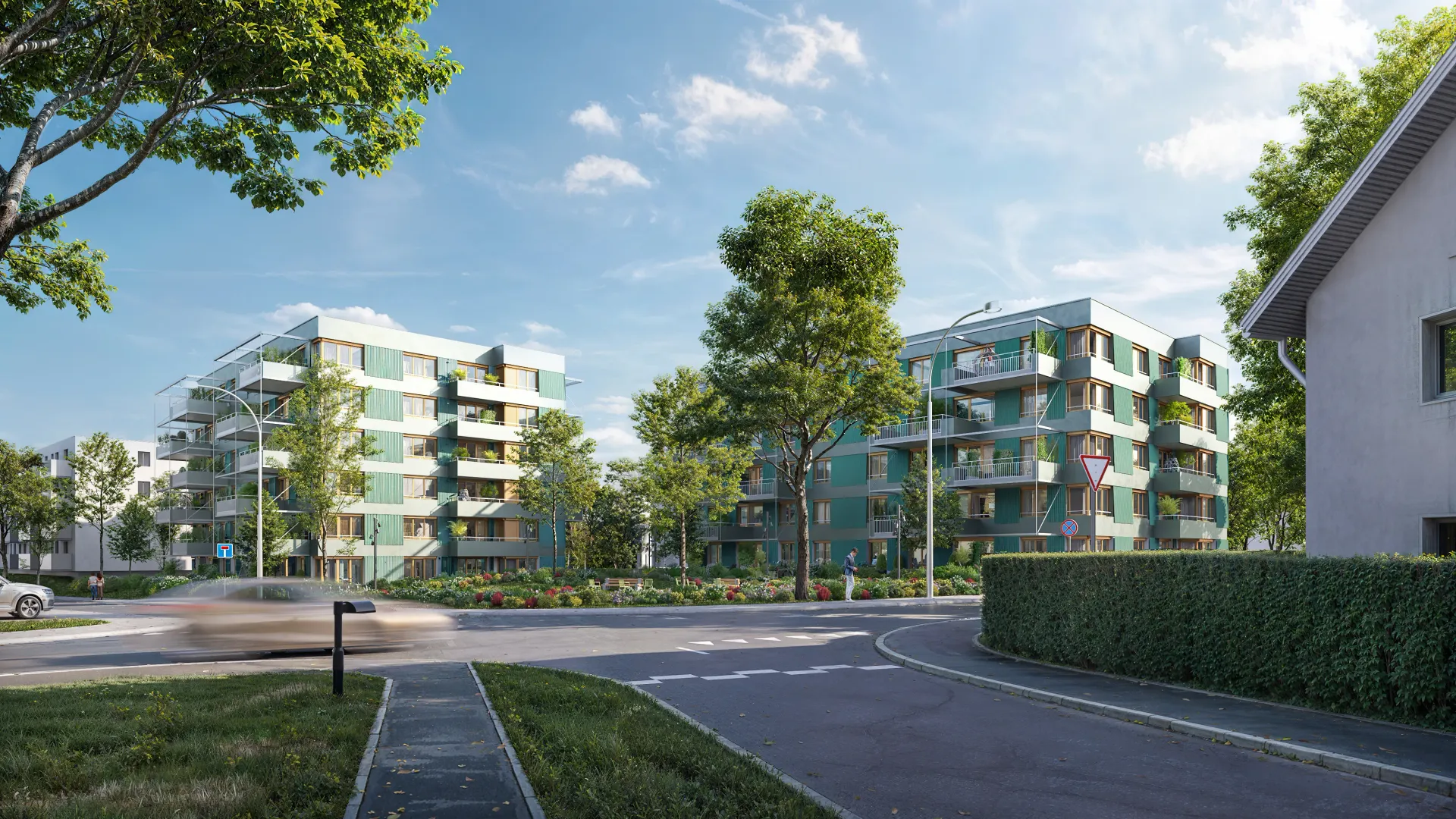 Exterior rendering of green-accented apartment blocks seen across a street junction with a bike path, hedge and leafy trees
