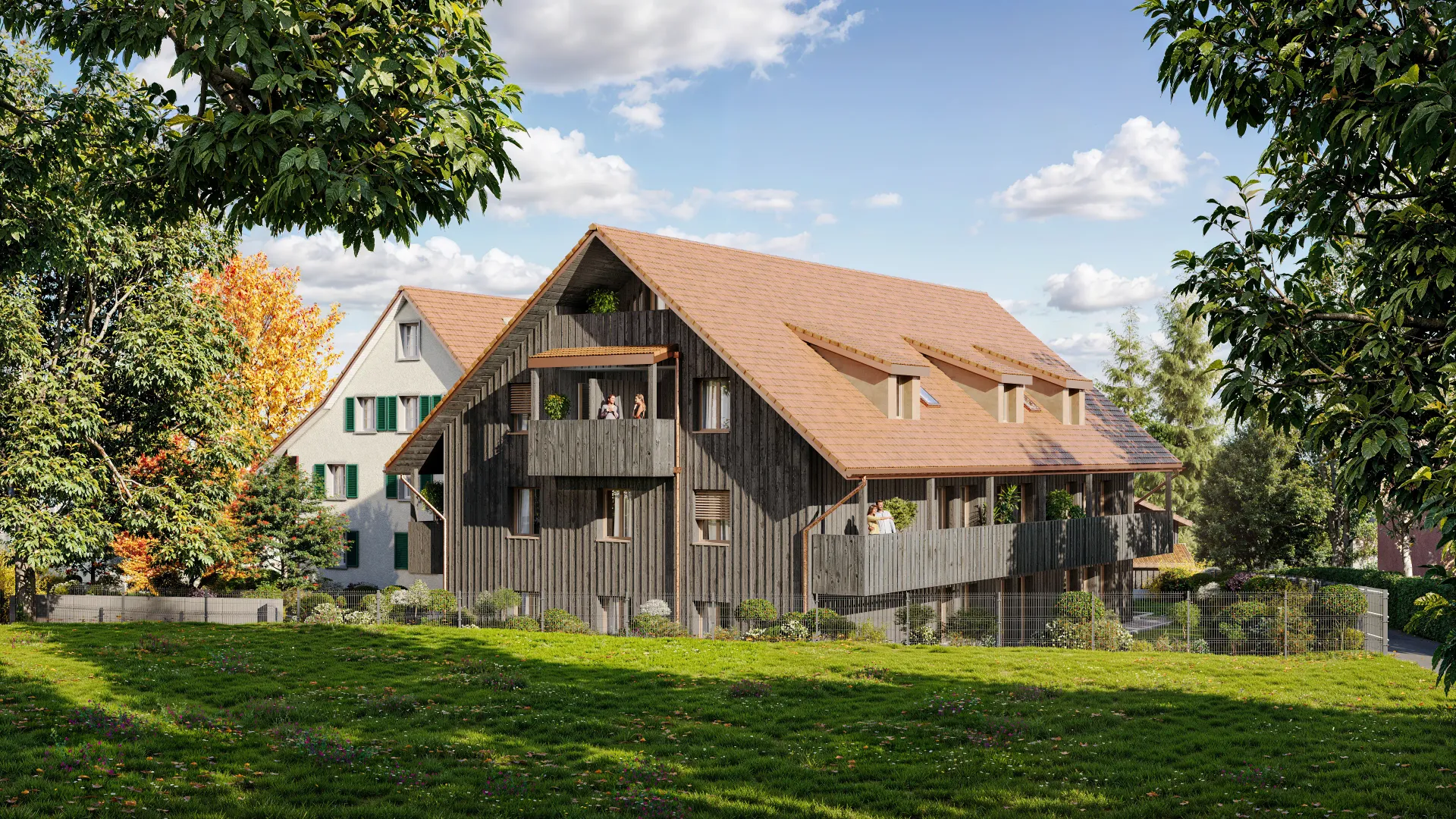 Exterior rendering of a dark timber barn-style residence with red-tan tiled roof and balcony, seen across a sunlit lawn with autumn trees