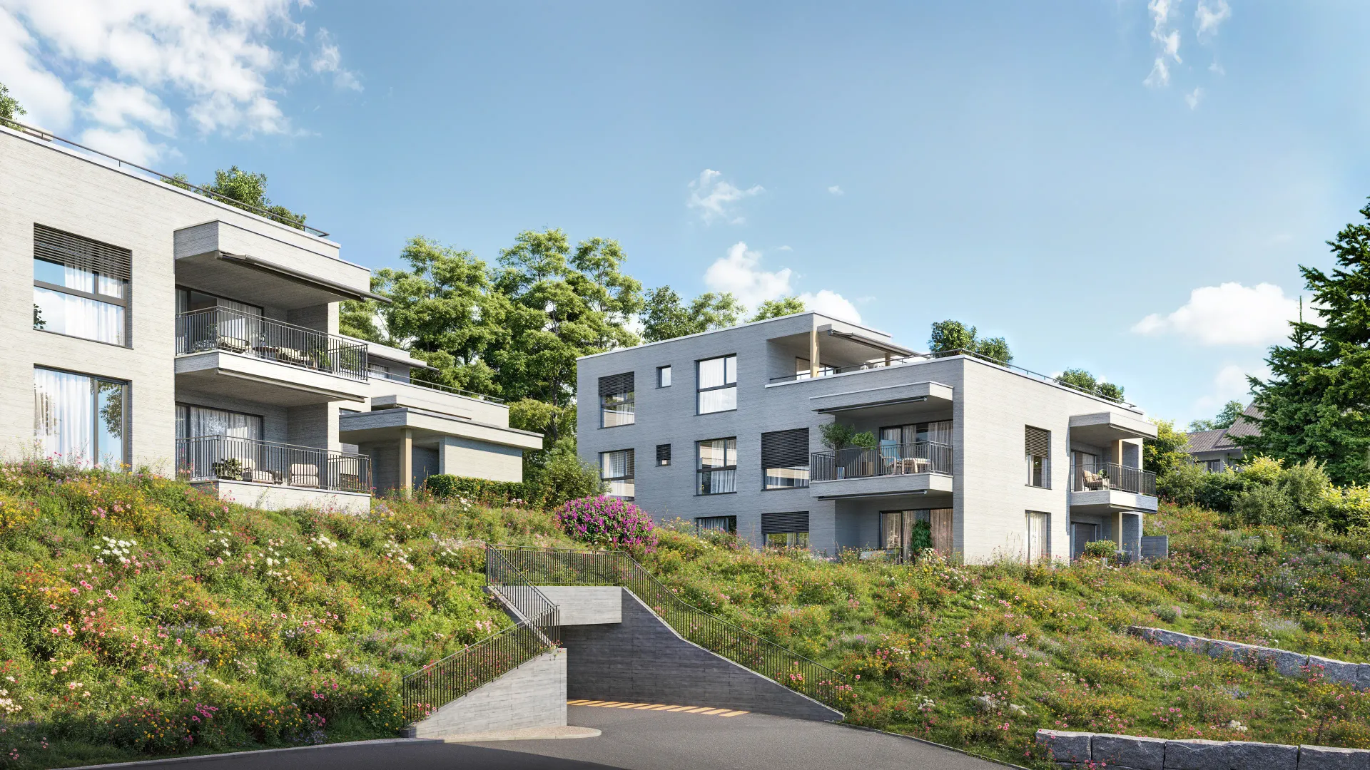 Exterior rendering of two white modern apartment buildings on a grassy slope with a concrete ramp leading to an underground garage